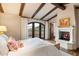 Bright bedroom with fireplace, hardwood floors and stunning views at 10719 E Rimrock Dr, Scottsdale, AZ 85255