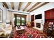 Living room with fireplace, hardwood floors, and access to patio at 10719 E Rimrock Dr, Scottsdale, AZ 85255