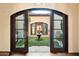 Private courtyard with lush landscaping and a central fountain at 10719 E Rimrock Dr, Scottsdale, AZ 85255