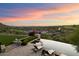 Infinity pool overlooking a scenic landscape and golf course at 10719 E Rimrock Dr, Scottsdale, AZ 85255