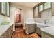 Well-appointed butler's pantry with farmhouse sink and custom cabinetry at 10719 E Rimrock Dr, Scottsdale, AZ 85255