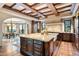Gourmet kitchen with large island and high-end appliances at 10719 E Rimrock Dr, Scottsdale, AZ 85255