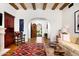 Living room with hardwood floors, wooden accents and access to courtyard at 10719 E Rimrock Dr, Scottsdale, AZ 85255
