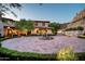 Home exterior with circular driveway and fountain at 10719 E Rimrock Dr, Scottsdale, AZ 85255