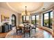 Elegant dining room with a round table, hardwood floors, and scenic views at 10719 E Rimrock Dr, Scottsdale, AZ 85255