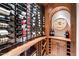 Spacious wine cellar with extensive racking, ideal for a large wine collection at 10719 E Rimrock Dr, Scottsdale, AZ 85255