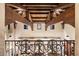 View of a home's interior with exposed wooden beams and high ceilings at 10719 E Rimrock Dr, Scottsdale, AZ 85255