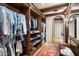 Custom walk-in closet with wooden shelving and drawers at 10719 E Rimrock Dr, Scottsdale, AZ 85255