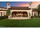 Back exterior view of home showcasing a large covered patio at 10719 E Rimrock Dr, Scottsdale, AZ 85255
