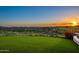 Landscaped backyard with sunset view and mountains in background at 10719 E Rimrock Dr, Scottsdale, AZ 85255