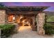 Built-in outdoor kitchen with stone and wood accents at 10719 E Rimrock Dr, Scottsdale, AZ 85255