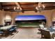 Outdoor patio with fireplace and stunning sunset views at 10719 E Rimrock Dr, Scottsdale, AZ 85255