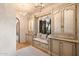 Built-in window seat with storage cabinets in hallway at 10719 E Rimrock Dr, Scottsdale, AZ 85255