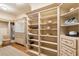 Spacious walk-in closet with ample shelving at 10719 E Rimrock Dr, Scottsdale, AZ 85255