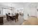 Formal dining room with a large table and seating for six, located near entryway at 10748 E Sunflower Ct, Florence, AZ 85132