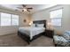 Main bedroom with large bed, nightstands, and ceiling fan at 4931 E Amarillo Dr, San Tan Valley, AZ 85140