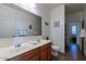 Double vanity bathroom with toilet and access to bedroom at 4931 E Amarillo Dr, San Tan Valley, AZ 85140