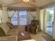Cozy living room featuring a sofa, armchair, and coffee table at 7750 E Broadway Rd # 10, Mesa, AZ 85208
