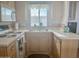 Compact kitchen with light wood cabinets and appliances at 7750 E Broadway Rd # 10, Mesa, AZ 85208
