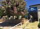 Carriage Manor Resort entrance with a covered walkway and lush landscaping at 7750 E Broadway Rd # 10, Mesa, AZ 85208
