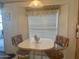 Bright kitchenette with a small table and chairs at 7750 E Broadway Rd # 10, Mesa, AZ 85208