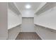 Large walk-in closet with double hanging rods and shelving at 9985 E Legend Ct, Gold Canyon, AZ 85118