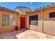 Private courtyard entry with red front door at 9985 E Legend Ct, Gold Canyon, AZ 85118