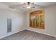 Bedroom with wood-look floors, a ceiling fan, and a large window at 9985 E Legend Ct, Gold Canyon, AZ 85118