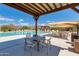 Relaxing community pool with shaded seating and mountain views at 9985 E Legend Ct, Gold Canyon, AZ 85118