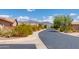 Residential street with desert landscaping and mountain views at 9985 E Legend Ct, Gold Canyon, AZ 85118