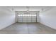Empty two-car garage with white walls and concrete floor at 9985 E Legend Ct, Gold Canyon, AZ 85118