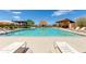 Inviting community pool with ample lounge chairs and a view at 9985 E Legend Ct, Gold Canyon, AZ 85118