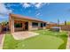 Home with covered patio, putting green, and hot tub at 9985 E Legend Ct, Gold Canyon, AZ 85118