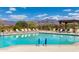 Sparkling community pool with lounge chairs and mountain views at 9985 E Legend Ct, Gold Canyon, AZ 85118