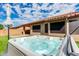 Hot tub with umbrella and putting green in background at 9985 E Legend Ct, Gold Canyon, AZ 85118