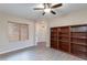 Living room with built-in shelving and access to the entryway at 9985 E Legend Ct, Gold Canyon, AZ 85118