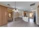 Bright dining area with wood-look floors, access to a patio, and an open layout at 9985 E Legend Ct, Gold Canyon, AZ 85118