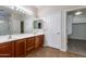 Double-sink bathroom with wood cabinets and a separate shower at 9985 E Legend Ct, Gold Canyon, AZ 85118