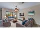 Spacious living room with wood-look flooring and comfy furniture at 9985 E Legend Ct, Gold Canyon, AZ 85118