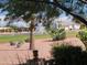 Landscaped backyard with a view of a lake and fountain at 2417 N Higley Rd, Mesa, AZ 85215