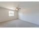 Bedroom with window and ceiling fan at 3708 E Joan De Arc Ave, Phoenix, AZ 85032