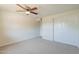Spacious bedroom with double door closet and ceiling fan at 3708 E Joan De Arc Ave, Phoenix, AZ 85032