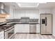 Modern kitchen with stainless steel appliances and granite countertops at 3708 E Joan De Arc Ave, Phoenix, AZ 85032