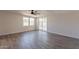 Spacious living area with wood-look floors and access to the backyard at 3708 E Joan De Arc Ave, Phoenix, AZ 85032