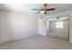 Well-lit bedroom with mirrored closet doors and neutral carpeting at 3708 E Joan De Arc Ave, Phoenix, AZ 85032