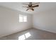 Bright bedroom with neutral carpeting and ceiling fan at 3708 E Joan De Arc Ave, Phoenix, AZ 85032