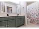 Clean bathroom with double sinks and a shower/tub combo at 14760 W Riviera Dr, Surprise, AZ 85379