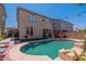 Inviting backyard oasis with sparkling pool and patio at 14760 W Riviera Dr, Surprise, AZ 85379