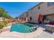 Stunning pool with spacious backyard and patio furniture at 14760 W Riviera Dr, Surprise, AZ 85379