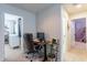Convenient hallway with a workspace and access to bedrooms at 14760 W Riviera Dr, Surprise, AZ 85379